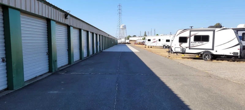 drive aisle with storage units on the left side and RV parking on the right side.
