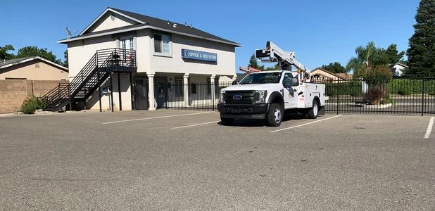 Front office of Purely Storage on Green Sands Ave in Atwater, CA with a white construction truck in front