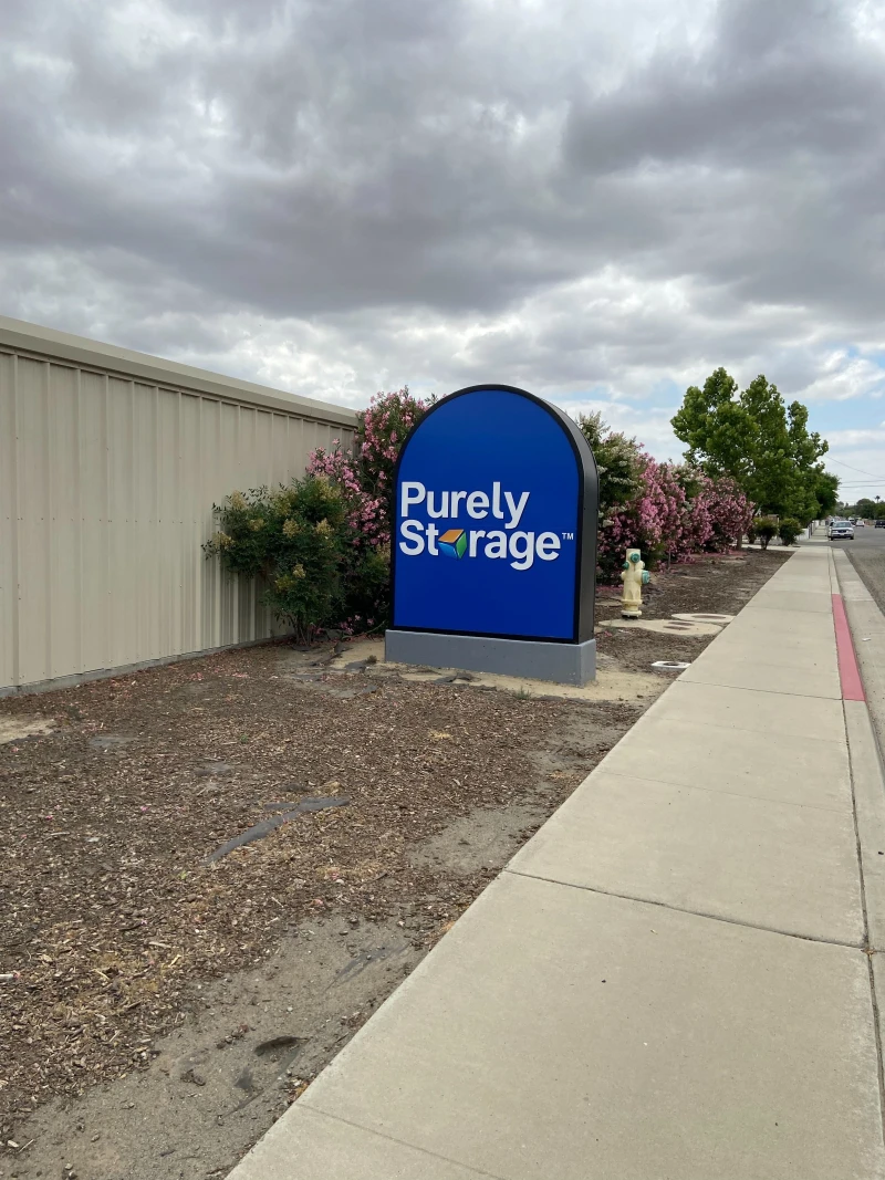 large blue sign outside storage facility with Purely Storage logo