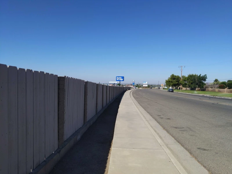 Kern Canyon Road alongside purely storage facility with large logo billboard in background