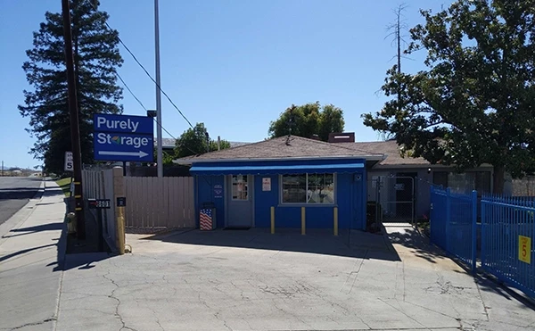 blue office at Purely Storage Bakersfield next to blue gate to the storage facility